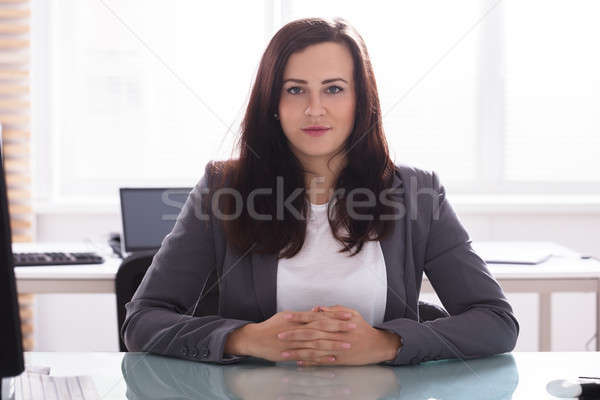 Portrait jeunes femme d'affaires séance bureau affaires [[stock_photo]] © AndreyPopov