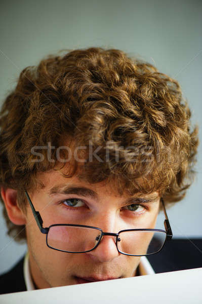 Empresário jovem vigoroso óculos atrás Foto stock © Andriy-Solovyov
