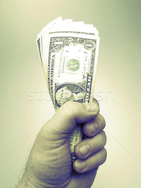 Dinero mano empresario uno dólar azul Foto stock © Andriy-Solovyov