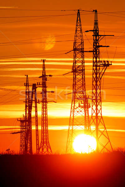 Stock photo: Transmission towers with sunset