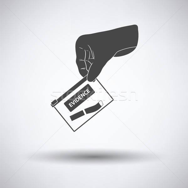 Hand holding evidence pocket icon Stock photo © angelp
