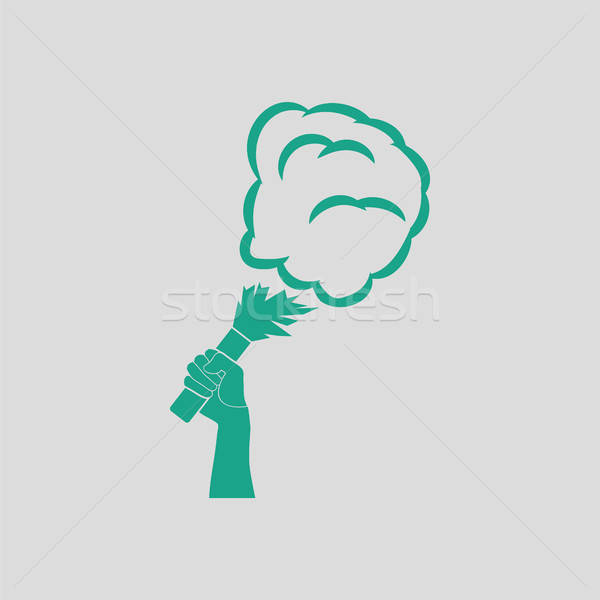 Football fans hand holding burned flayer with smoke icon Stock photo © angelp