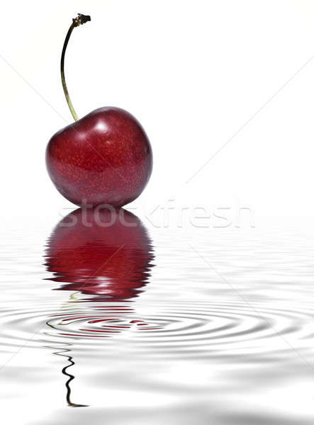 Stock photo: Cherry reflected on water.