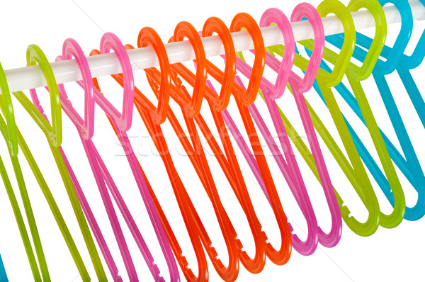 Colored hangers on a rod isolated on white Stock photo © anmalkov