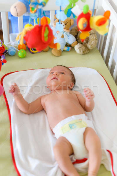Cute baby playing in bed  Stock photo © anmalkov