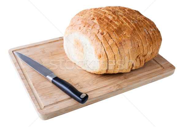 Sliced white bread on the wood board with knife Stock photo © anmalkov