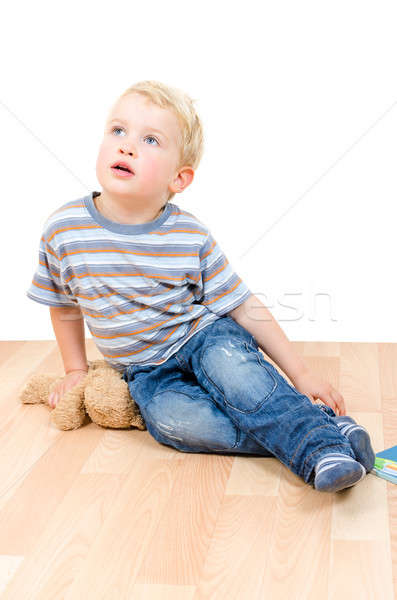 Cute little boy sitting with teddy bear and book isolated Stock photo © anmalkov