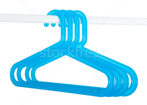 Blue hangers on a rod isolated on white Stock photo © anmalkov