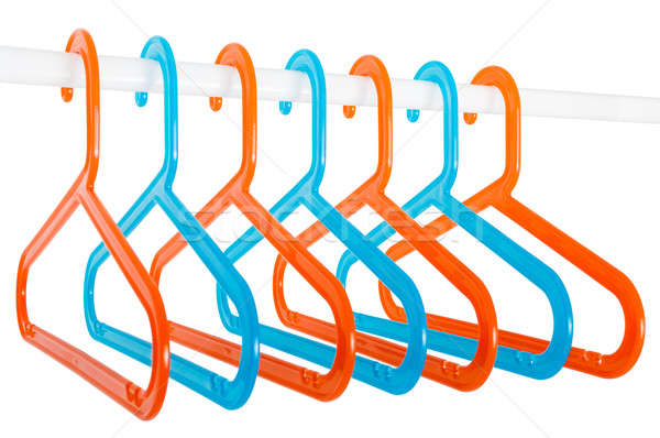 Colored hangers on a rod isolated on white Stock photo © anmalkov