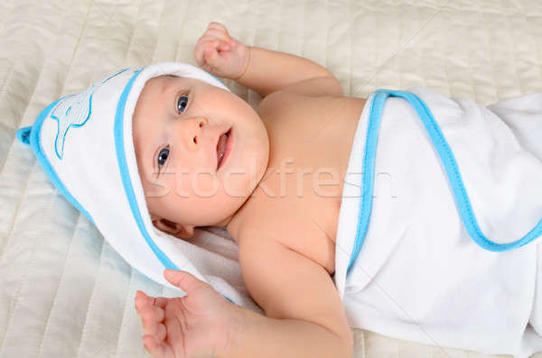 Smiling baby in a hooded towel after bath Stock photo © anmalkov