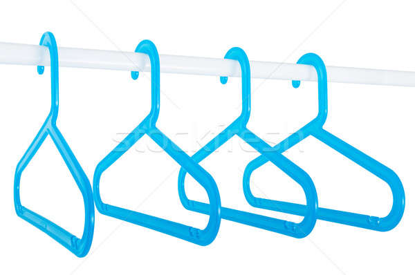 Blue hangers on a rod isolated on white Stock photo © anmalkov