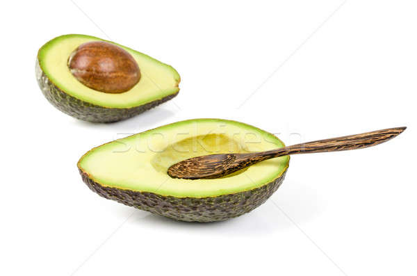 Fresh avocado with wooden spoon isolated Stock photo © anmalkov