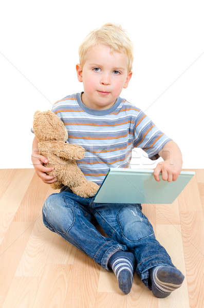 Cute little boy sitting with teddy bear and book isolated Stock photo © anmalkov