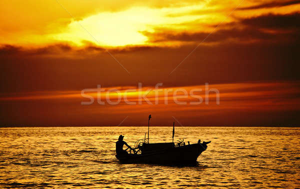 Pescador barco dramático puesta de sol masculina hermosa Foto stock © Anna_Om