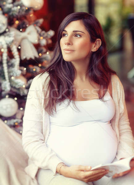 Pregnant woman reading book Stock photo © Anna_Om