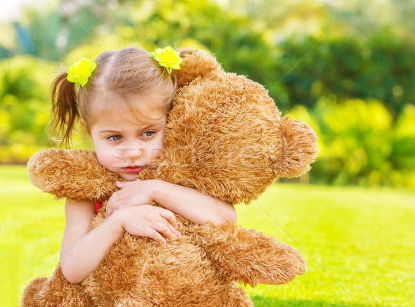 a girl with teddy