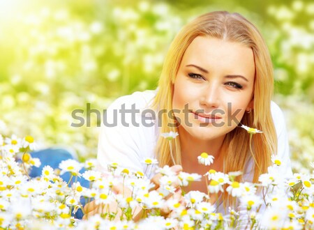 Gyönyörű női fektet virág fiatal gyönyörű lány Stock fotó © Anna_Om