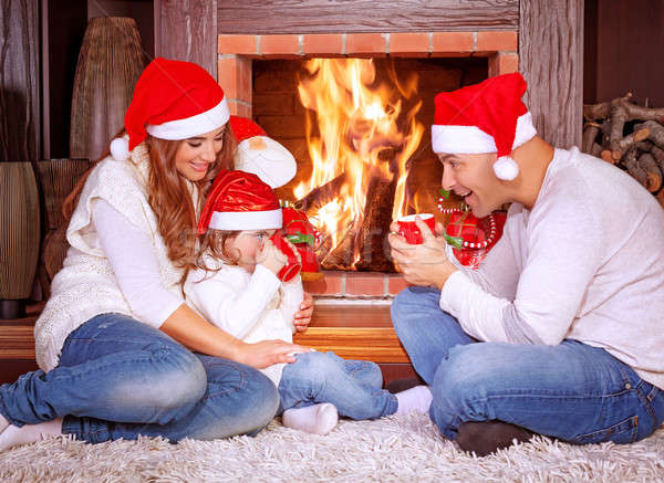 Сток-фото: счастливая · семья · камин · родителей · Дед · Мороз