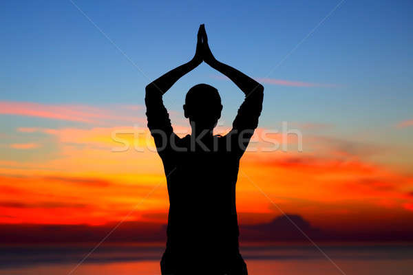 Doing yoga exercises outdoors Stock photo © Anna_Om