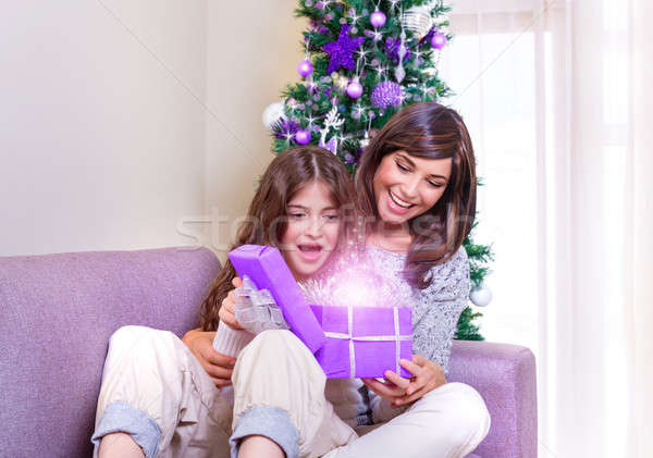 Opening Christmastime gift Stock photo © Anna_Om