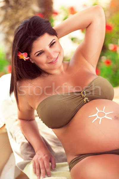 Pregnant girl on the tropical resort Stock photo © Anna_Om