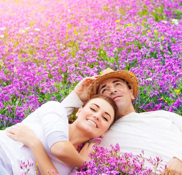 Young family on floral glade Stock photo © Anna_Om