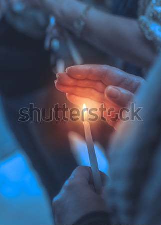 Believer in a church with candle Stock photo © Anna_Om