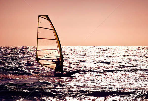 Windsurfer silhouette over sea sunset Stock photo © Anna_Om
