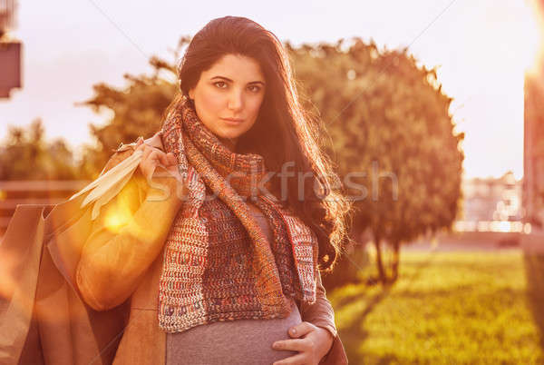 Stock photo: Pregnant woman with shopping bag