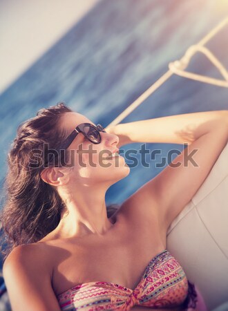 Beautiful woman on sailboat Stock photo © Anna_Om