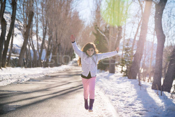 Happy girl runs and jumps up from happiness Stock photo © Anna_Om