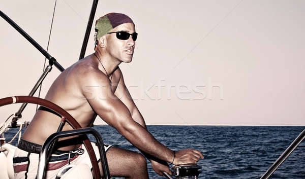 Handsome man on sail boat Stock photo © Anna_Om