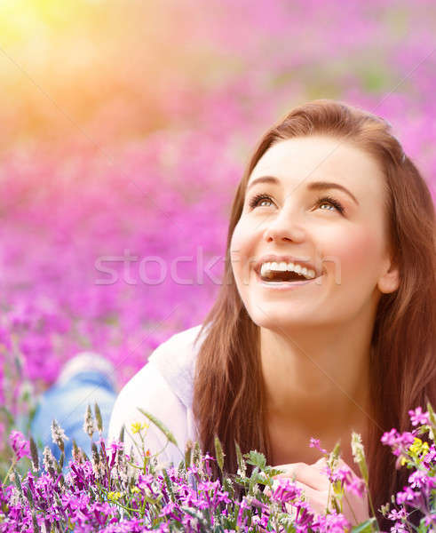 Beautiful woman on floral field Stock photo © Anna_Om