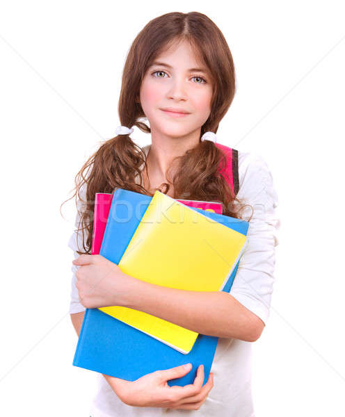 Stock photo: Cute schoolgirl with colorful books