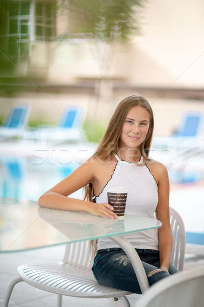 Cute girl having coffee in outdoors cafe Stock photo © Anna_Om