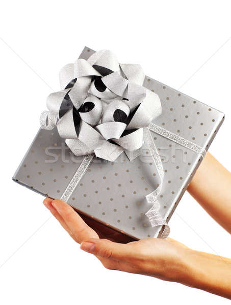 Silver gift box with hands Stock photo © Anna_Om