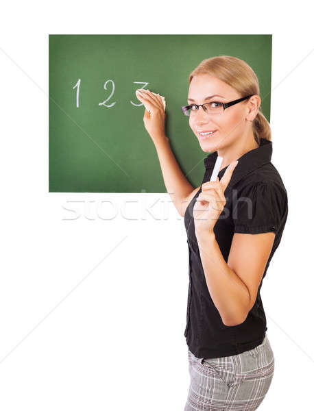 Teacher writting on chalkboard Stock photo © Anna_Om
