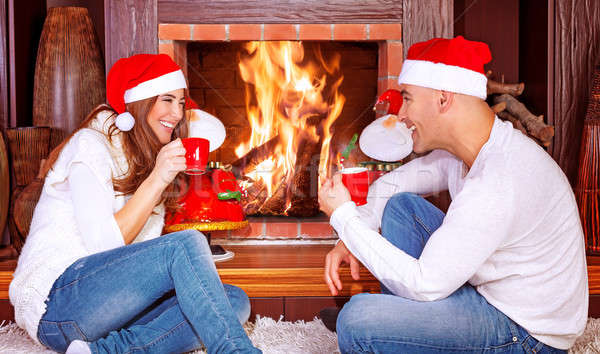 Loving couple by fireplace Stock photo © Anna_Om