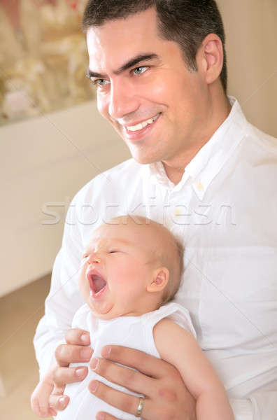 Happy father with yawning daughter on hands Stock photo © Anna_Om