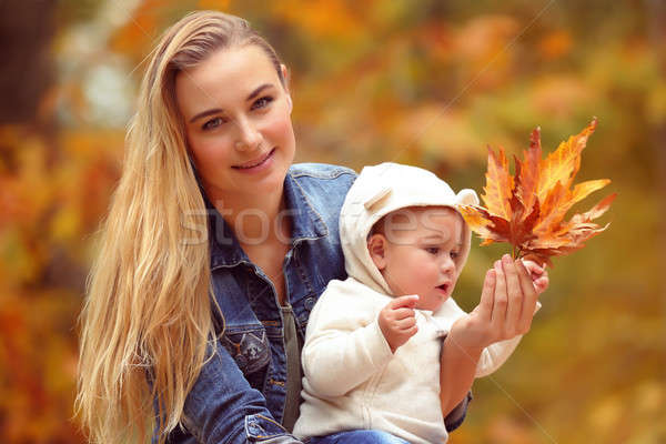 Mother with son in autumn park Stock photo © Anna_Om