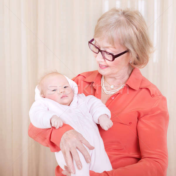 Happy granny holding newborn child Stock photo © Anna_Om
