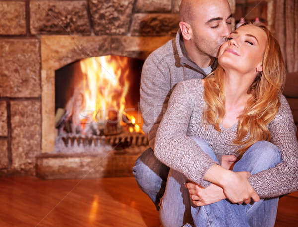 Loving couple near fireplace Stock photo © Anna_Om