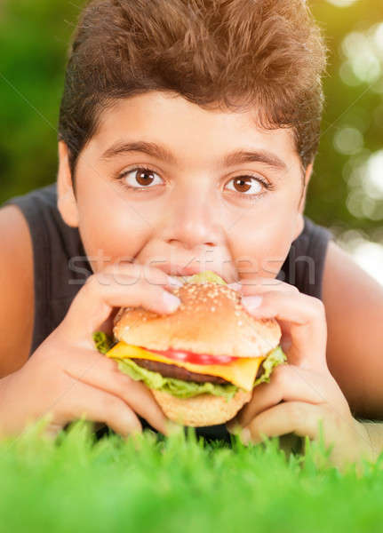 Hungry boy eating burger Stock photo © Anna_Om