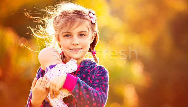 Sweet baby girl with doll Stock photo © Anna_Om