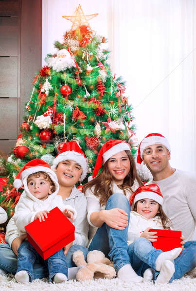 Happy family near Christmas tree Stock photo © Anna_Om