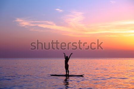 Doing yoga asanas on the beach Stock photo © Anna_Om