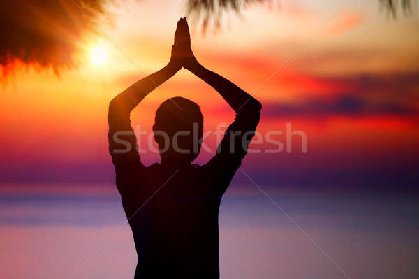 Doing yoga on sunset Stock photo © Anna_Om