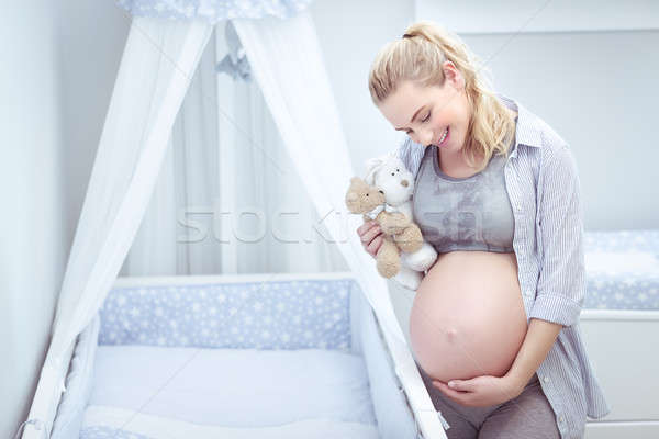 Cute pregnant woman at home Stock photo © Anna_Om