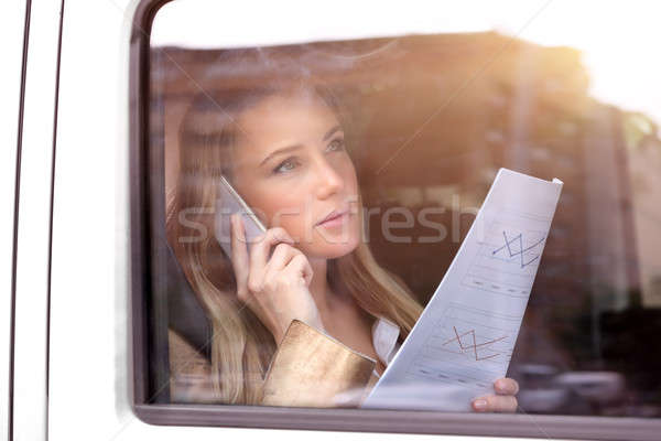 Stock photo: Serious business woman in the car