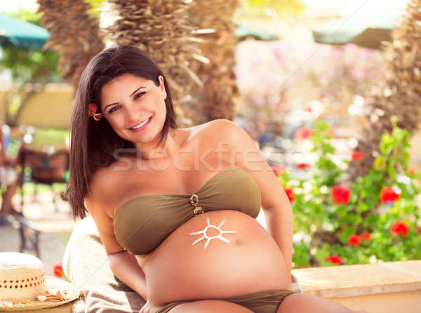 Pregnant female on the beach Stock photo © Anna_Om